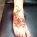 brown lotus ankle tattoos